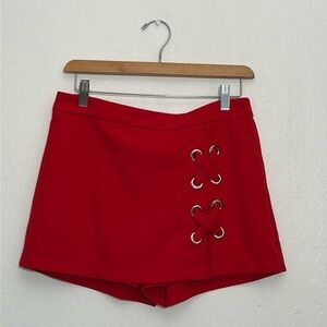 Unique skirt with X-Large  grommet detail in front of slit